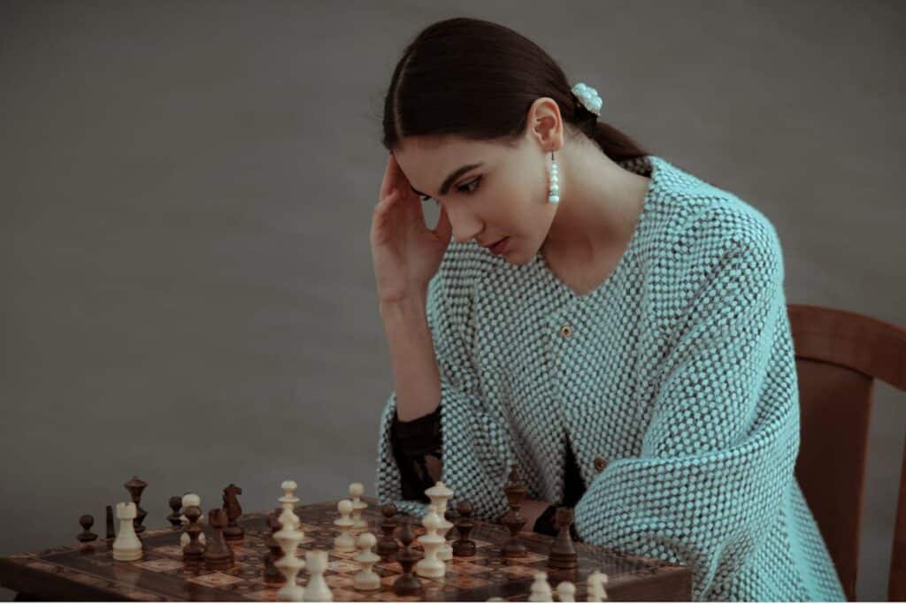 girl playing chess